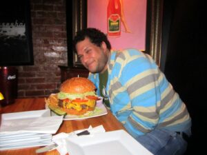 @tweetsfromchris takes on Nicky Rotten's 2.5 lbs. burger challenge (with a gigantic side of fries)